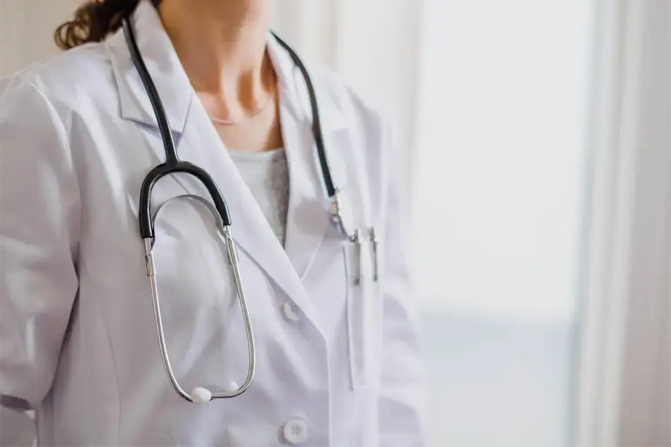 Close-up of a doctor's white coat and stethoscope