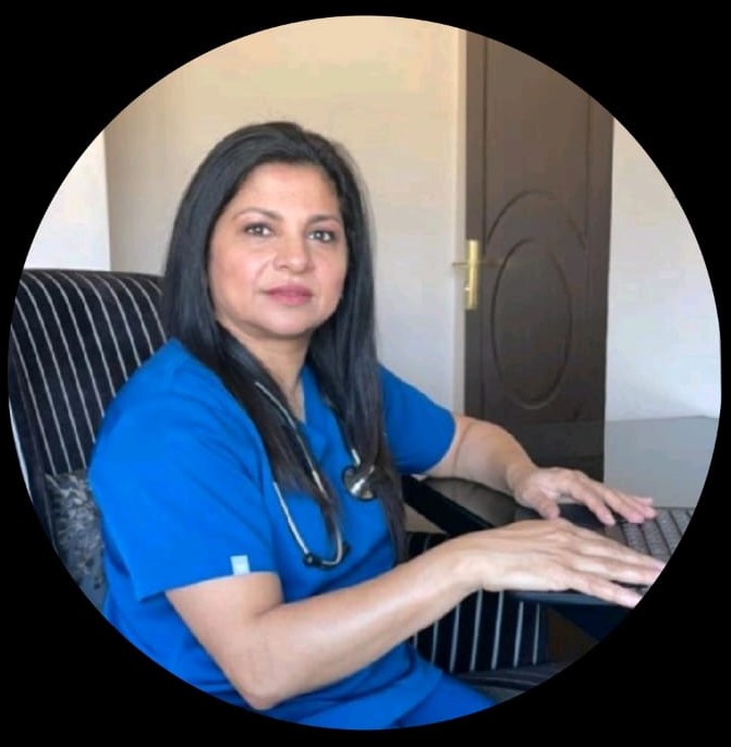 Dr Shireen Faruk Surtee at her desk during an online patient consultation